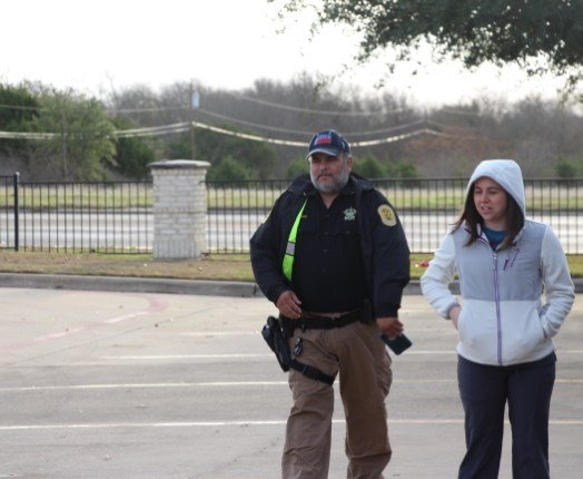 Dental team member and first responder walking outdoors