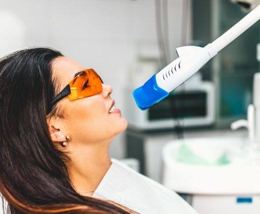 Dental patient receiving teeth whitening