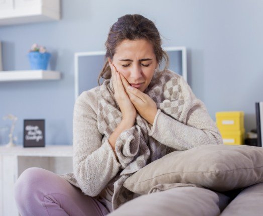 Woman in pain before tooth extractions