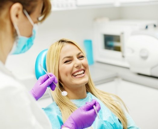Woman laughing after wisdom tooth extractions