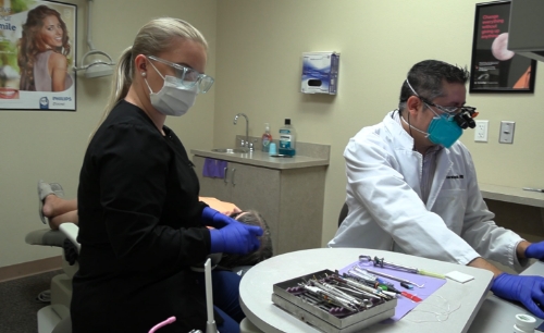 Dentist in Copperas Cove Texas and dental team member providing dentistry services