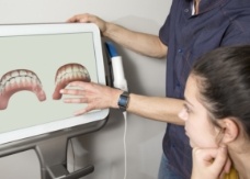 Copperas Cove Texas dentist and patient looking at smile design technology on chairside computer screen