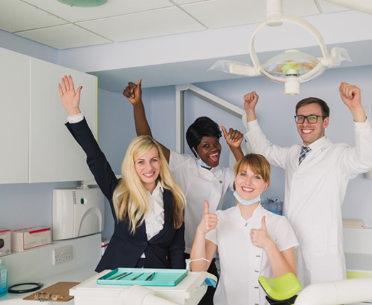 Dental team members happy in the office 