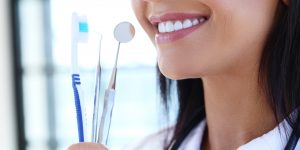 smile close-up with dental tools