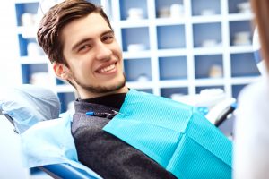 man smiling in the dental chair