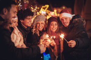 young adults dressed in holiday attire