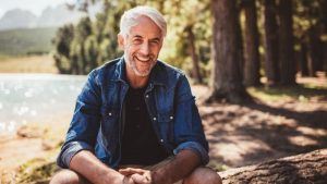 mature man by lake