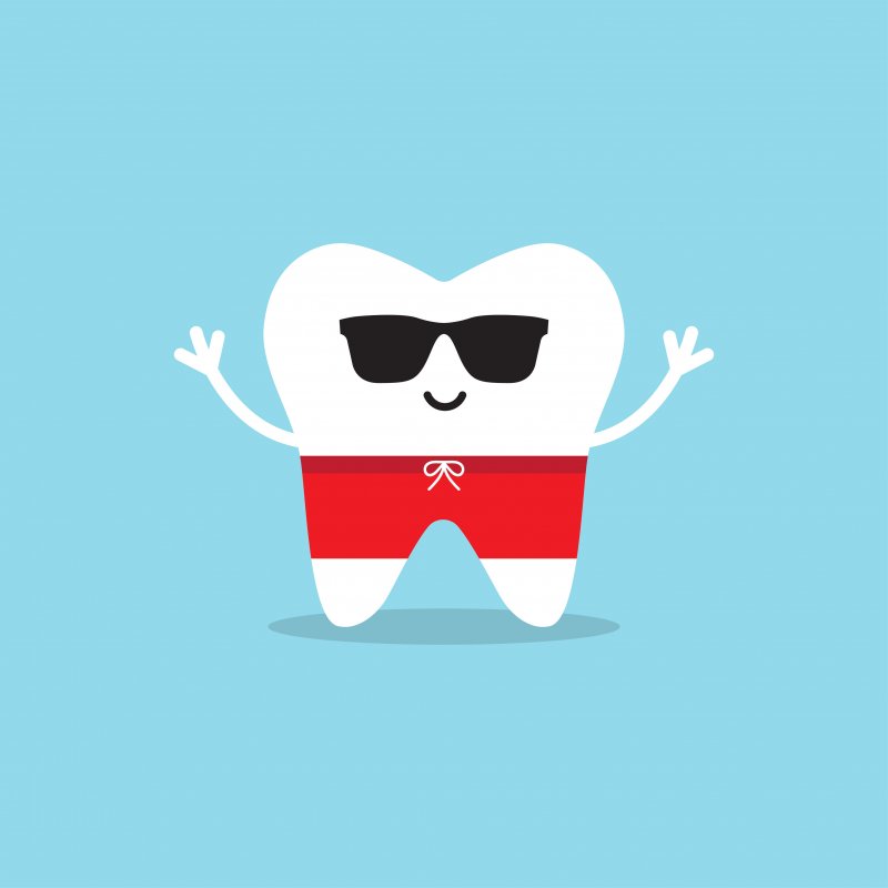 Happy healthy tooth in sunglasses and swim trunks