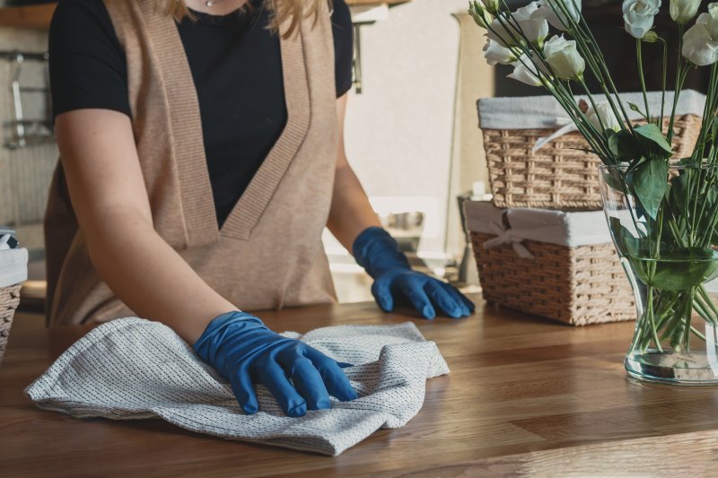 A woman performing spring cleaning in her home