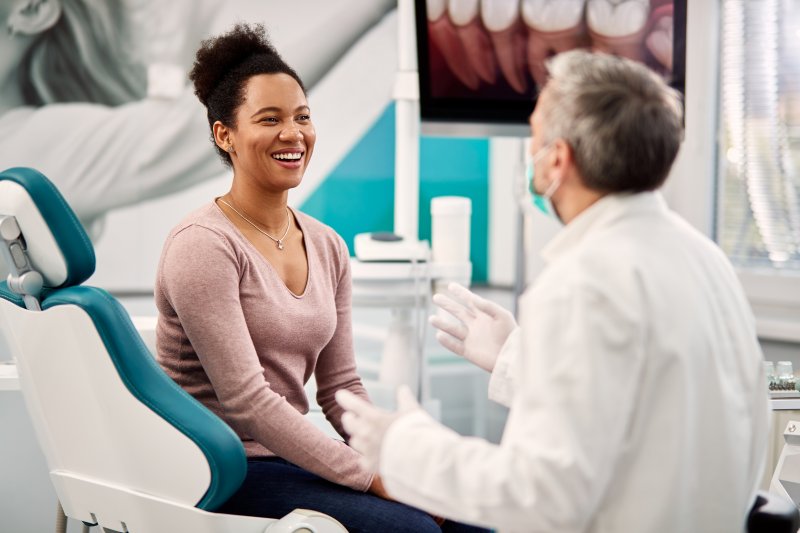 A woman asking questions before her smile makeover
