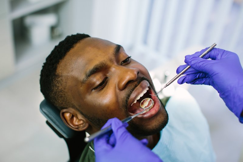 A young man receiving a dental checkup